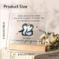 Preview: Transparente Acrylplatte mit Holzsockel mit Motiv "Wenn Pinguine ihren Partner finden, bleiben sie für immer zusammen."